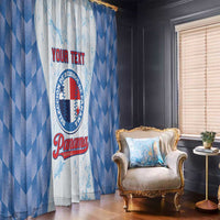 Baseball window curtain with blue chevron pattern and printed circular logo beside chair