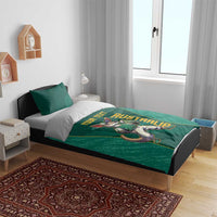 Green bedding set with kangaroo mascot and YOUR TEXT on bed