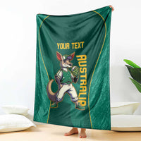 Green blanket with kangaroo mascot, custom text, and vertical AUSTRALIA print, draped on floor