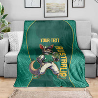 Green blanket with kangaroo mascot and custom text, vertical AUSTRALIA print, on sofa