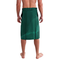Green lavalava-style knee skirt, solid front with dark side seam and elastic waistband