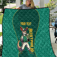Green quilt with quilted pattern and kangaroo mascot graphic, 'YOUR TEXT' banner