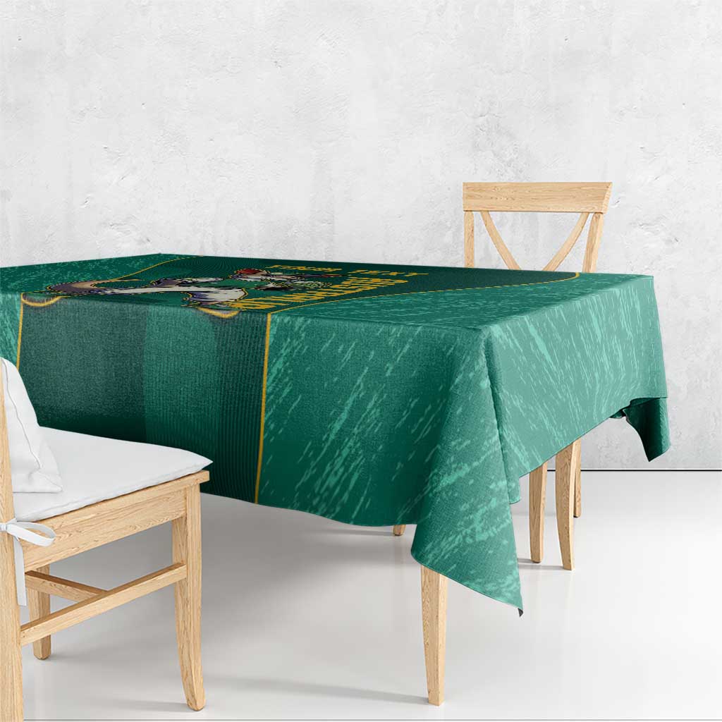 Green tablecloth corner with kangaroo mascot graphic and gold trim
