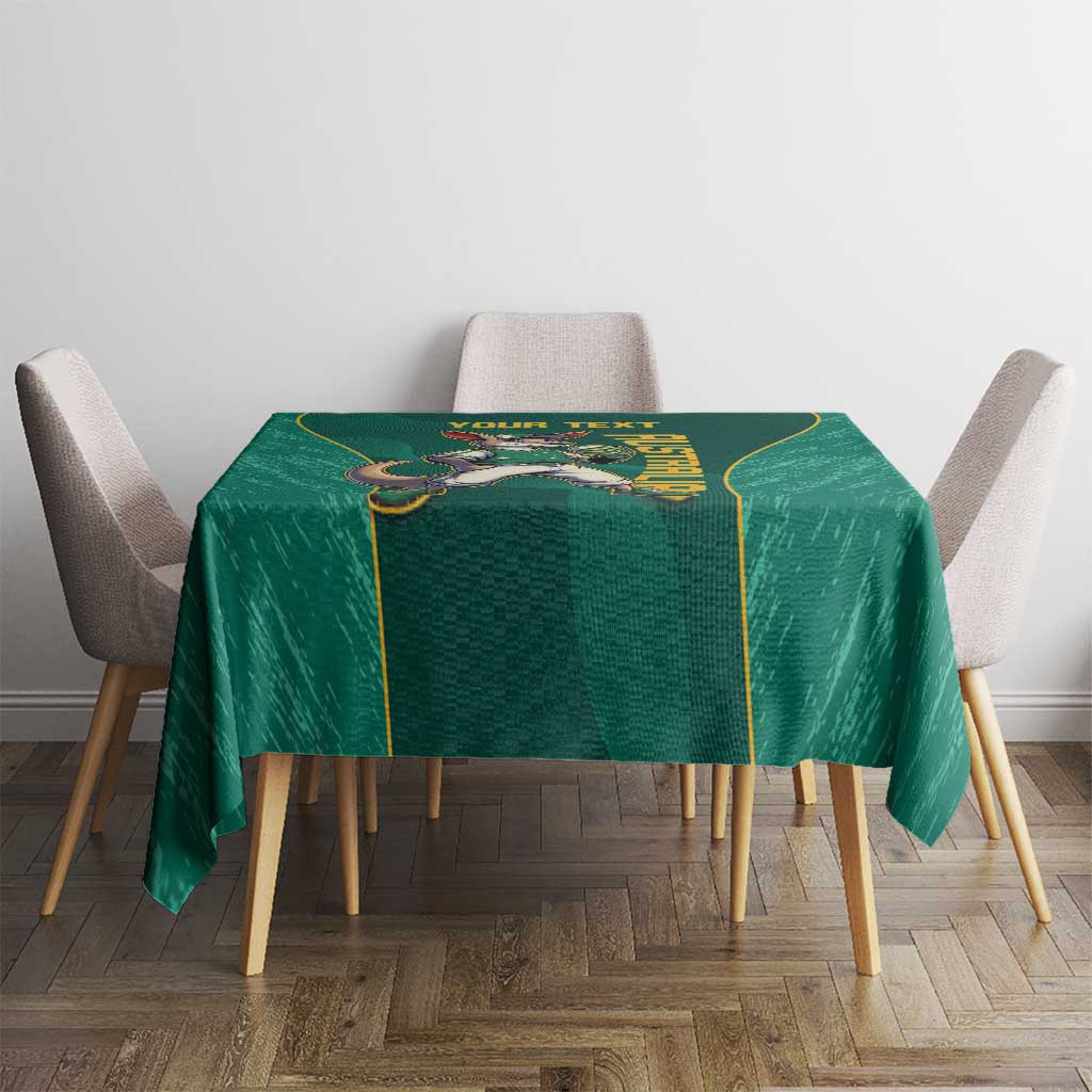 Green tablecloth with centered kangaroo mascot graphic and gold edging