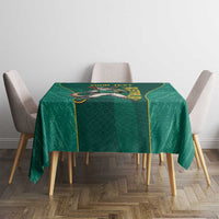 Green tablecloth with centered kangaroo mascot graphic and gold edging