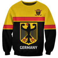 Yellow crewneck hockey sweatshirt with Germany crest and red-striped front panel