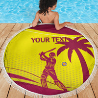 Round beach blanket in maroon and yellow with tassel fringe and cricket graphics