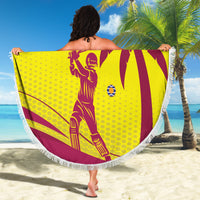 West Indies-themed round beach blanket, maroon and yellow, with tassel trim