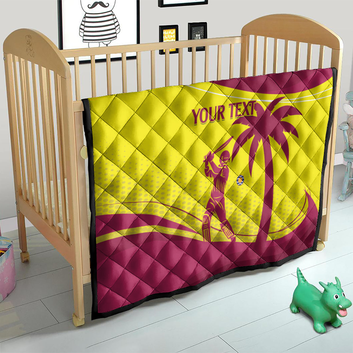 Cricket quilt on a bed in maroon and yellow with diamond quilting and 'YOUR TEXT' emblem