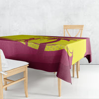 Maroon and yellow custom cricket tablecloth over a dining table, corner drape