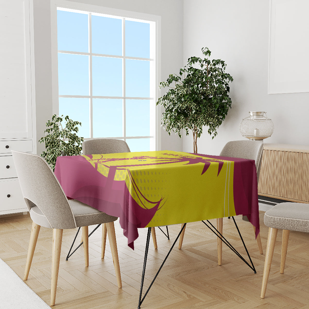 Custom cricket tablecloth in maroon with yellow graphics, draped over dining table