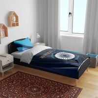 Blue cricket bedding set on bed with navy-and-teal emblem design and pillowcases