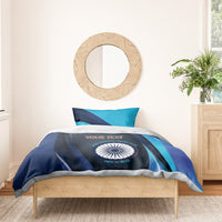 Navy-blue and teal cricket bedding set with round emblem and striped pillowcases