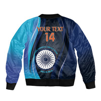Blue bomber jacket back with India cricket emblem, YOUR TEXT and 14, black ribbed hem
