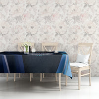 Blue cricket tablecloth with circular emblem and teal geometric stripes on rectangular table.