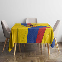 Yellow tablecloth on dining table with blue and red vertical stripe sections