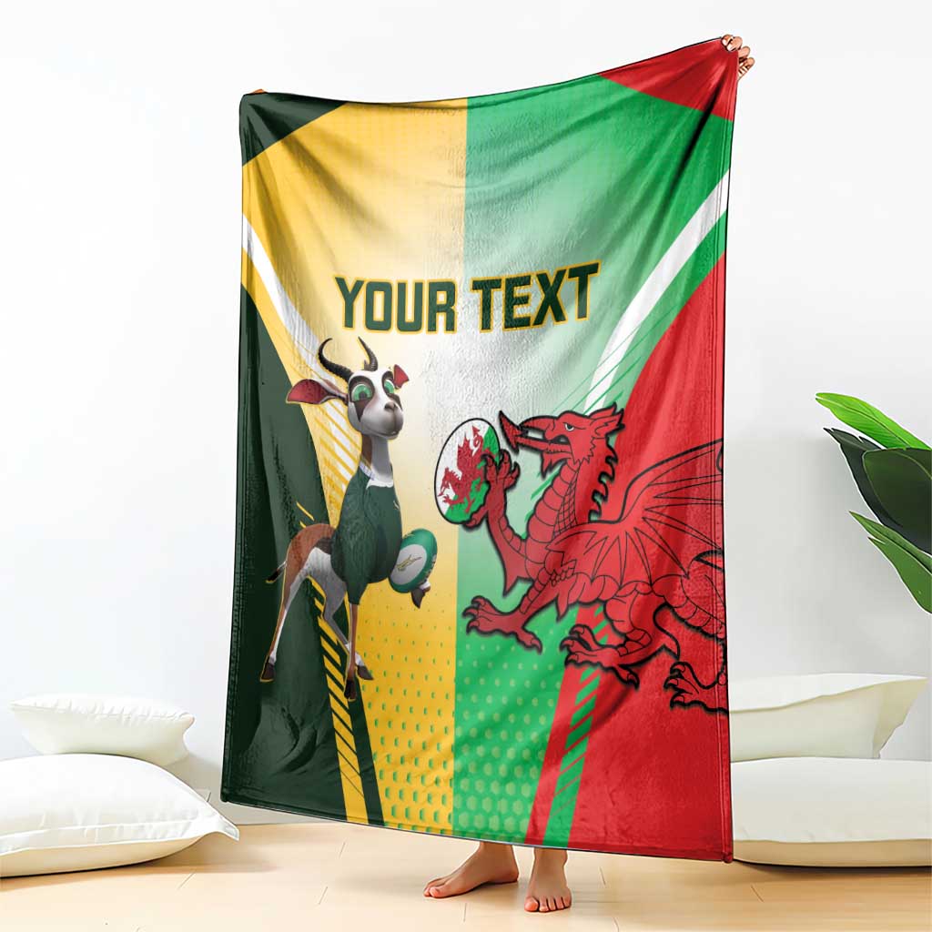 Rugby blanket draped on floor with green, yellow, and red flag blocks, dragon and goat art