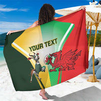 Custom rugby sarong with red, green, and yellow panels and “YOUR TEXT” mascot print