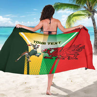 Custom rugby sarong with red and green panels, dragon and badge graphics, “YOUR TEXT”