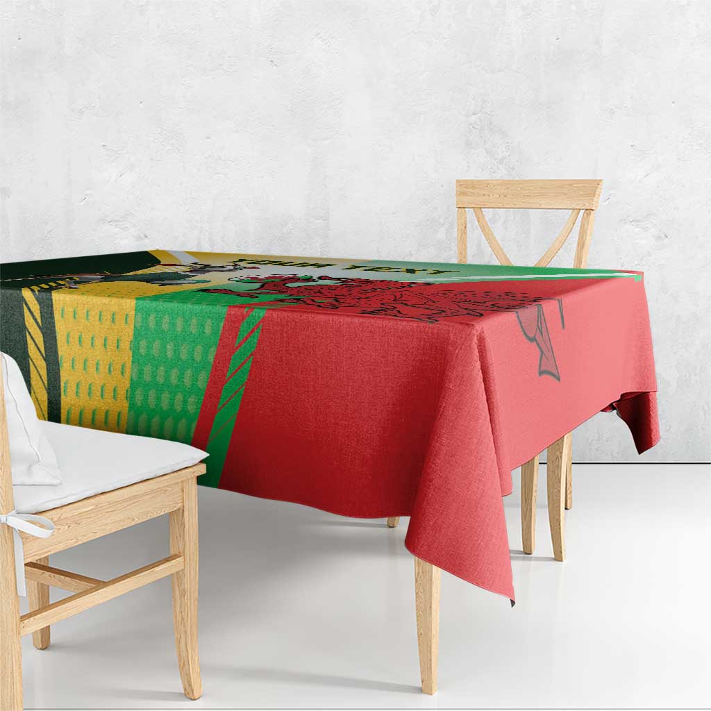 Red tablecloth draped on dining table with green and yellow rugby graphic