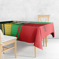 Red tablecloth draped on dining table with green and yellow rugby graphic