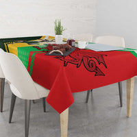Red tablecloth with large dragon-style rugby emblem and green-yellow side panels