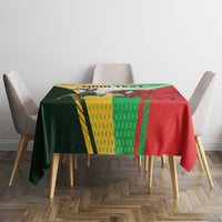 Red tablecloth with green-yellow stripes and rugby mascot emblem, centered view