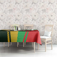 Red tablecloth with green and yellow rugby emblem, shown across dining set