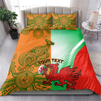 Rugby bedding set on bed: red, green & orange duvet with red dragon mascot and 2 pillows