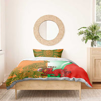 Rugby bedding set on bed: orange, green & red duvet with mascot graphic and matching pillowcases