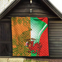 Quilt blanket hanging on porch with red, green, white, and orange design; custom text