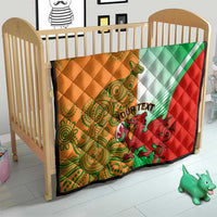 Quilt blanket on baby crib with red, green, white, and orange kangaroo and custom text