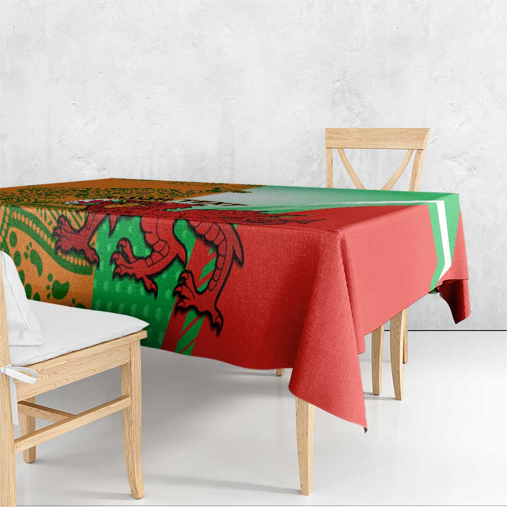 Red and green rugby tablecloth draped on a bench with large creature and stripe design