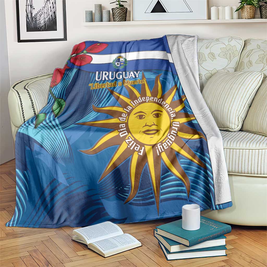Blue Uruguay independence day blanket with coat of arms and sun face motif