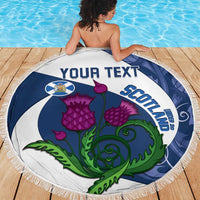 Round beach blanket with 'YOUR TEXT' and Scottish crest, purple thistles on blue circle, fringe