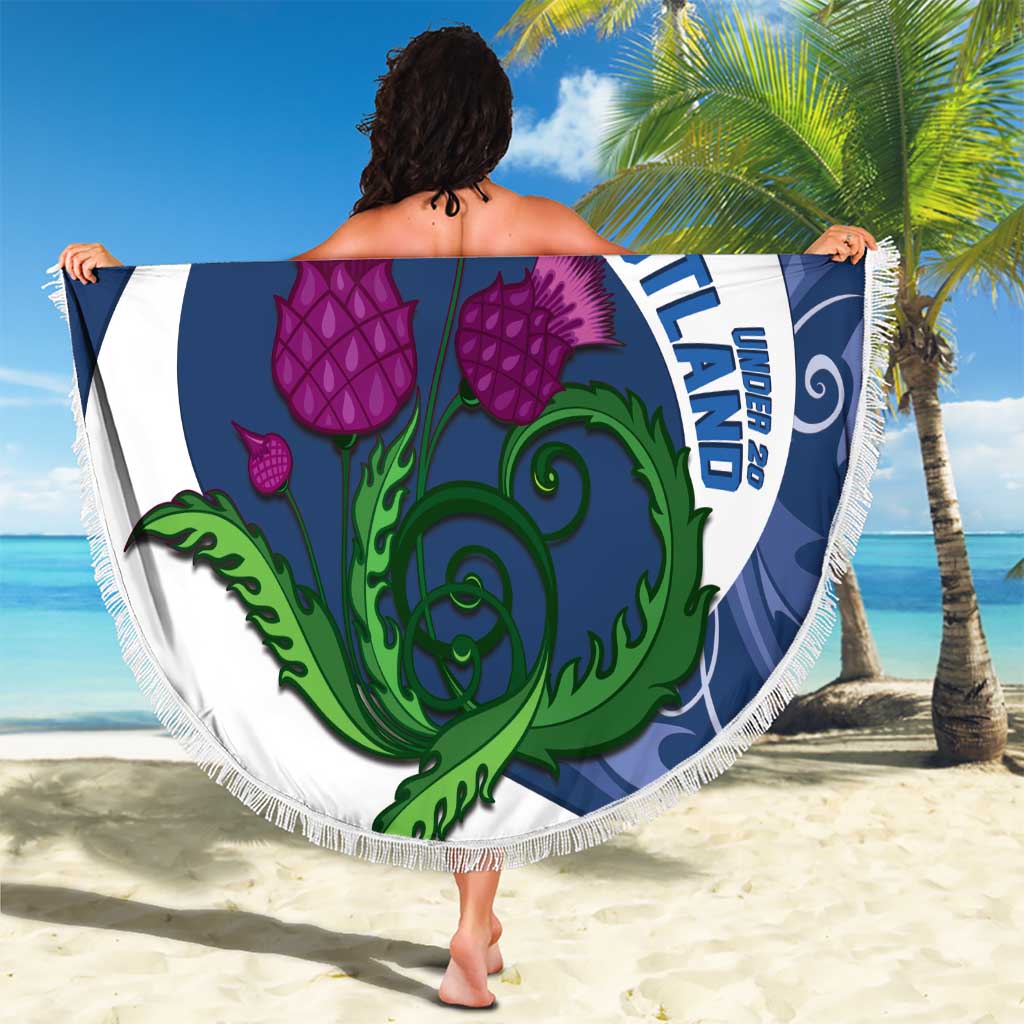 Round beach blanket with blue-and-white crest, purple thistles, green banner, white fringe