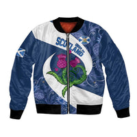 Blue and white bomber jacket with ribbed cuffs, front zipper, Scotland badge and thistle