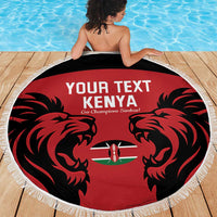 Red round beach blanket with lion artwork, Kenya flag emblem, and white fringe edge
