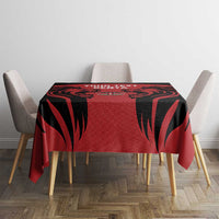 Red tablecloth with black feather-like pattern and centered Kenya text