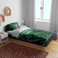 Green and black Kenya-themed bedding set with duvet cover, two striped pillows, lion graphics