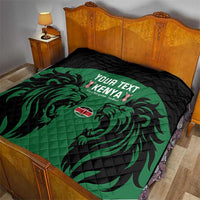 Quilted rugby quilt on bed: black backing with green lion design and Kenya text