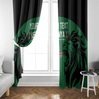 Green and black window curtain panels with lion artwork framing glass door