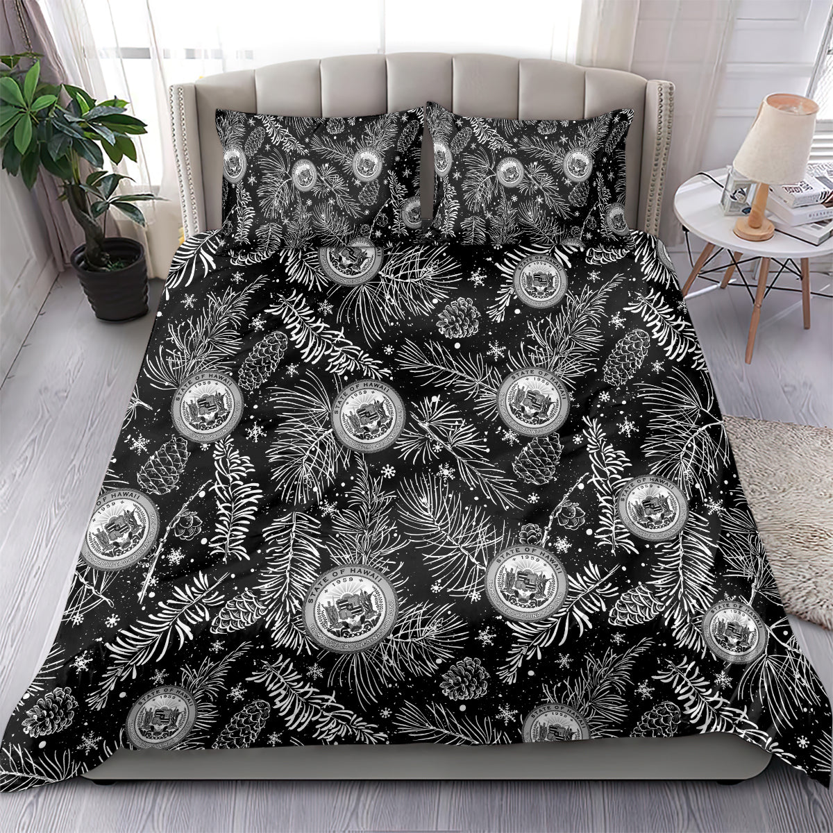 Black bedding set with matching pillow featuring white pine/leaf print and crest emblems