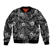 Black bomber jacket with full-zip front and tropical Christmas crest buttons, ribbed cuffs