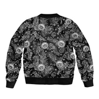 Black bomber jacket back with tropical Christmas crest print and ribbed hem and cuffs