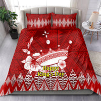 Red bedding set with Tonga Ngatu crown design; 'Happy King's Day' text on comforter, two pillows