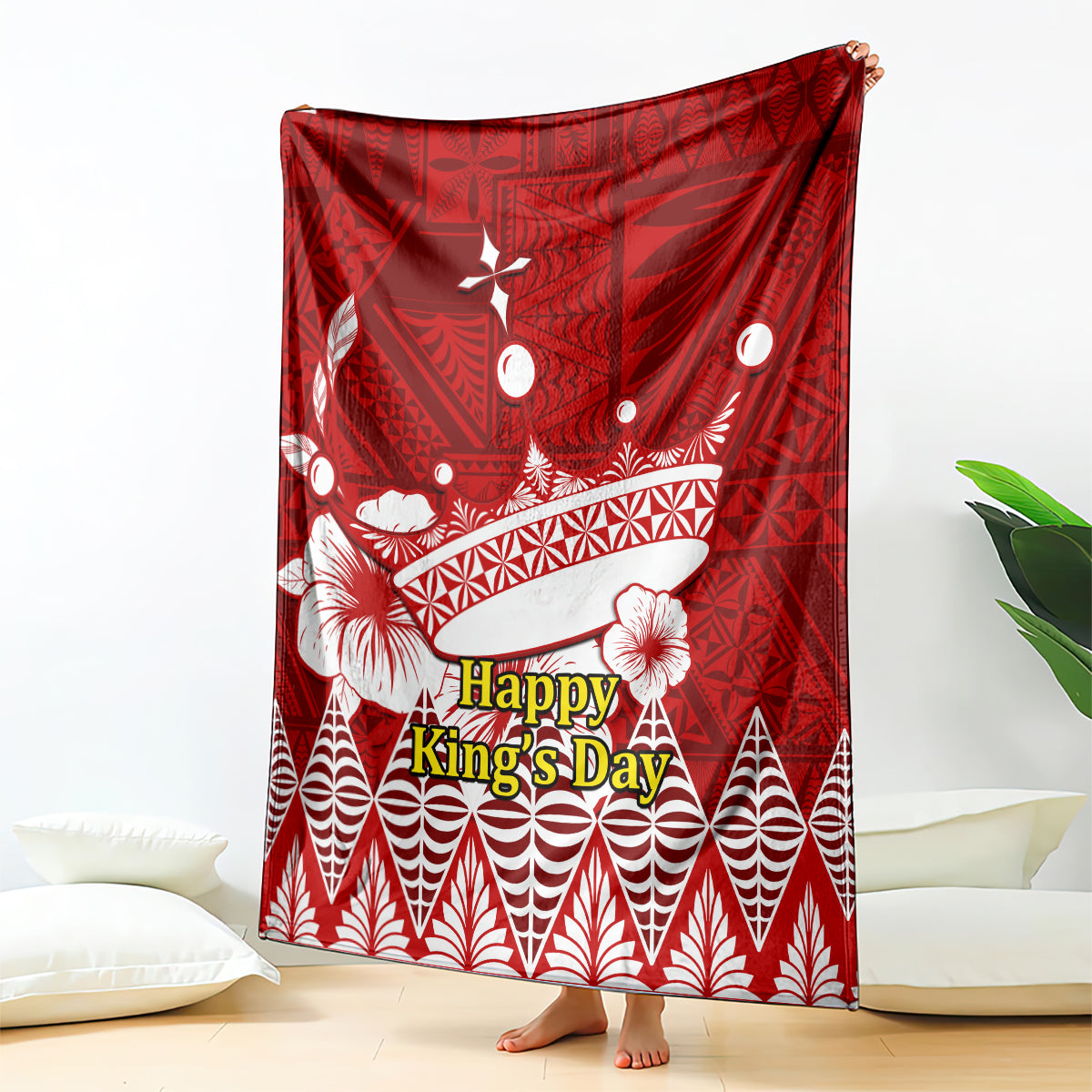 Red Happy King’s Day blanket with white crown, shell, and geometric Tongan-style pattern