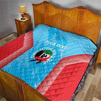 Cricket quilt on a bed with light blue center, red base, custom text and circular logo