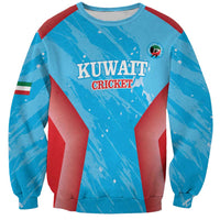 Blue crewneck sweatshirt with Kuwait Cricket graphic and circular emblem, ribbed cuffs