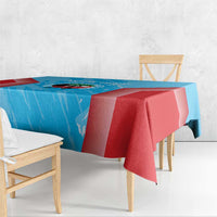 Blue and red cricket tablecloth with seam detail and draped corners on furniture